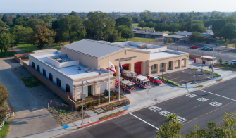 Buena Park Fire Station No. 61 aerial view showing equipment bays with emergency vehicles