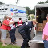 Red Cross volunteers handing out supplies after Hurricane Harvey